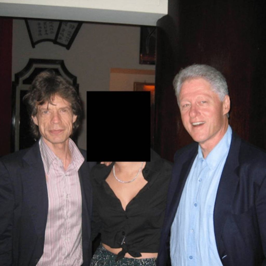 Bill Clinton und Mick Jagger posieren bei einem Event