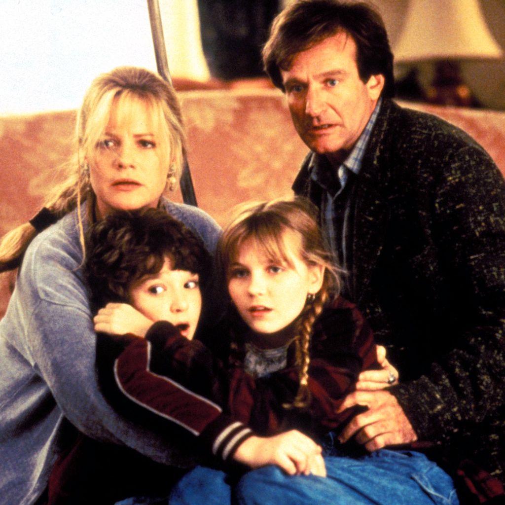 Bonnie Hunt, Bradley Pierce, Kirsten Dunst und Robin Williams im Film "Jumanji" (1995)