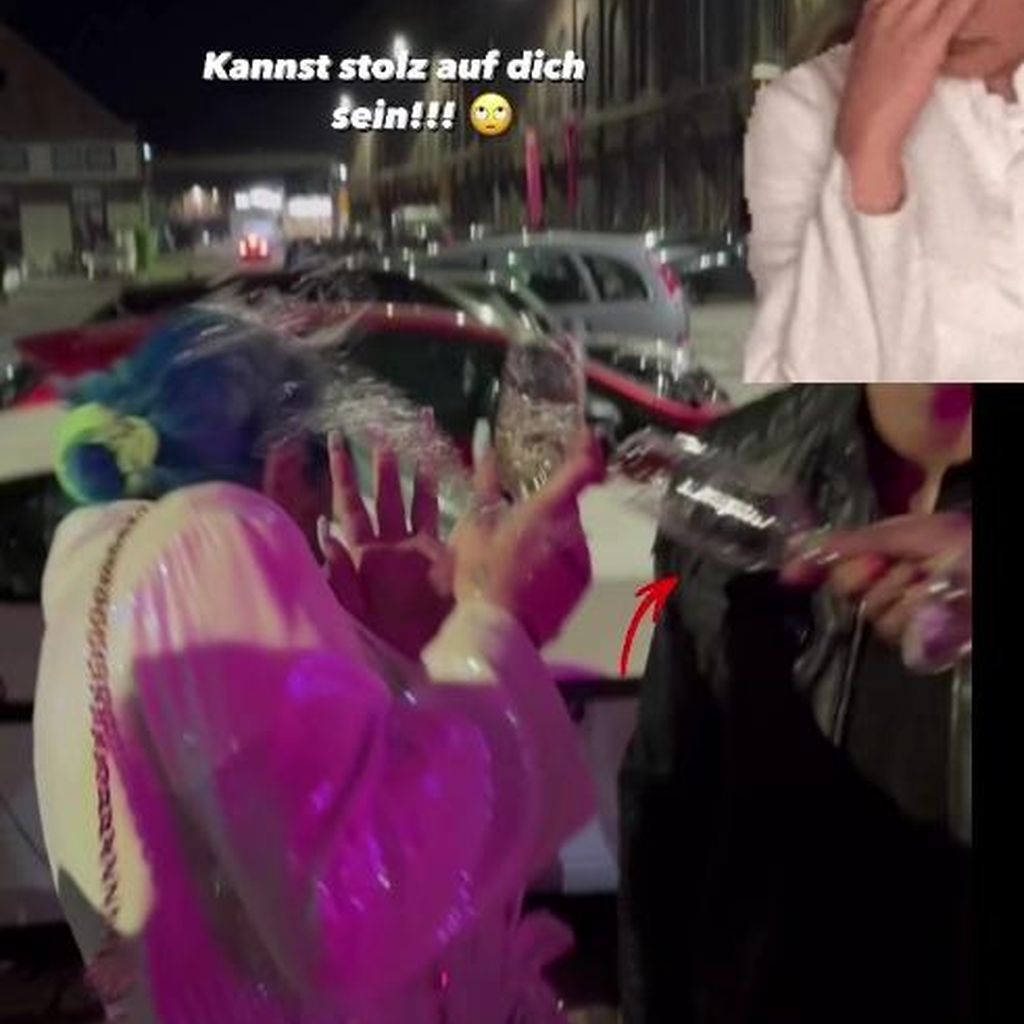 Kate Merlan wird mit Sekt überschüttet