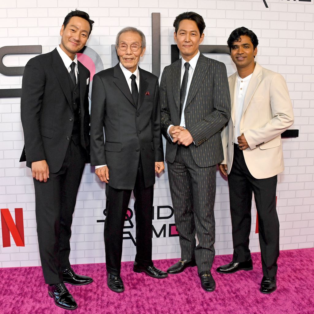 Park Hae-soo, O Yeong-su, Lee Jung-jae, und Anupam Tripathi, "Squid Game"-Stars