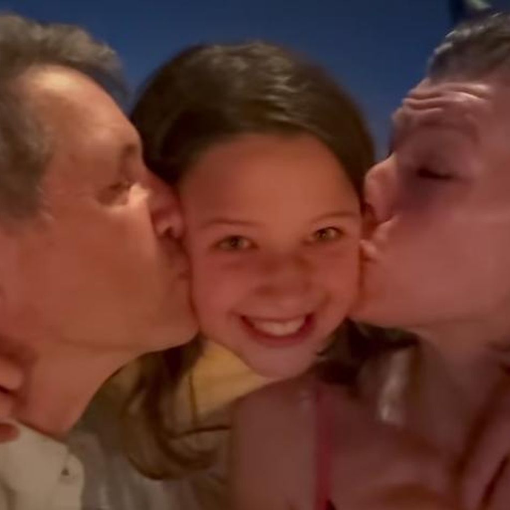 Paul W.S. Anderson (l.), Milla Jovovich (r.) und ihre Tochter
