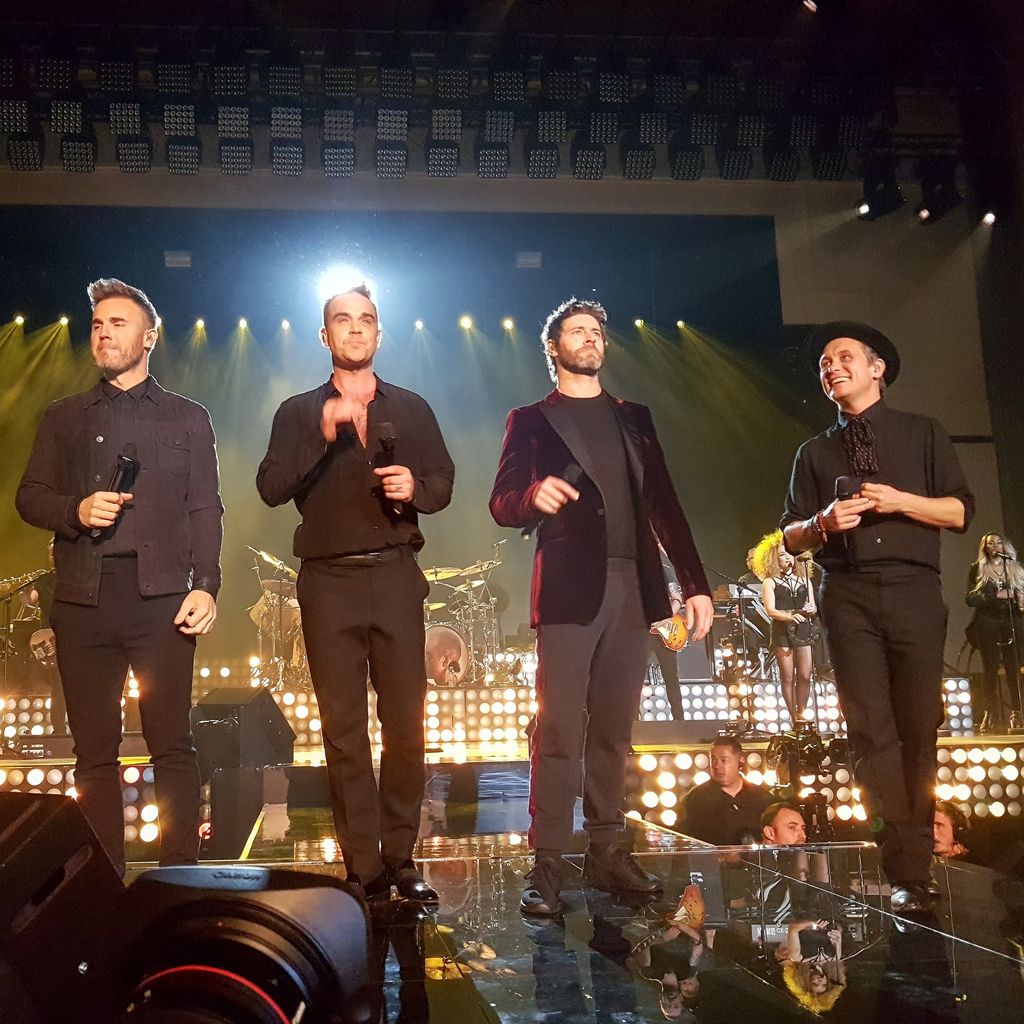 Gary Barlow, Robbie Williams, Howard Donald und Mark Owen im November in London