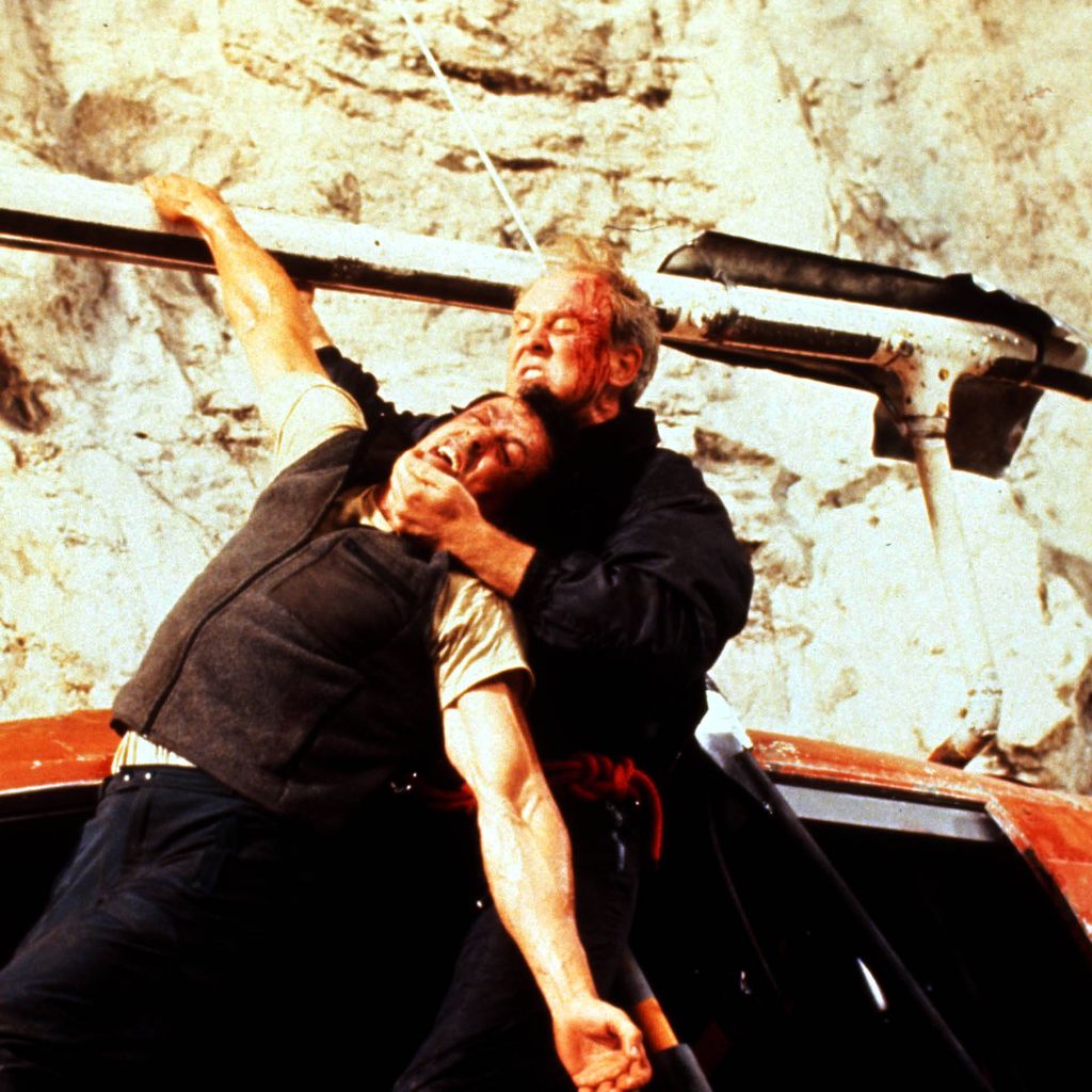 Sylvester Stallone und John Lithgow im Actionfilm "Cliffhanger", 1993