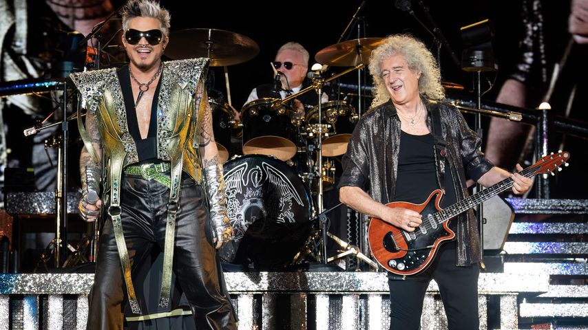 Adam Lambert, Roger Taylor und Brian May bei einem Auftritt von Queen