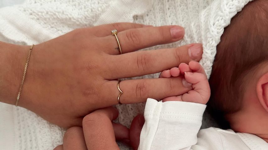 Alina Mour und Tim Radtke mit ihrem Baby