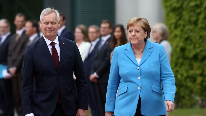 Der finnische Minister Antti Rinne und Angela Merkel