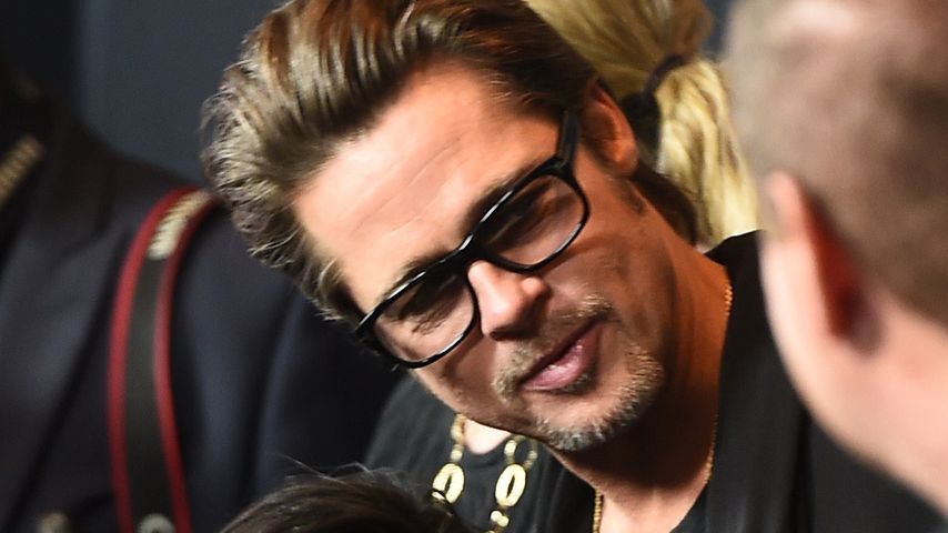 Brad Pitt mit seinen Kindern Pax und Shiloh im Jahr 2014