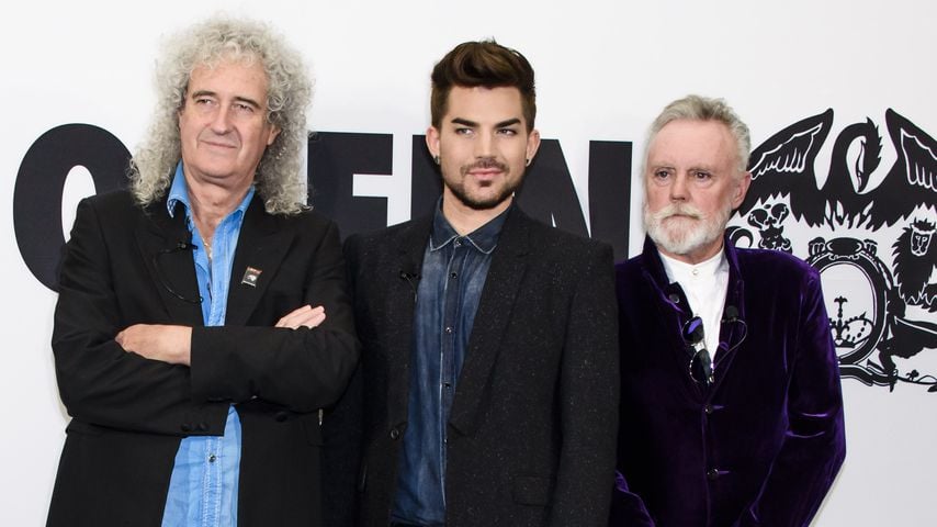Brian May, Adam Lambert und Roger Taylor bei einem Event in Berlin 2014