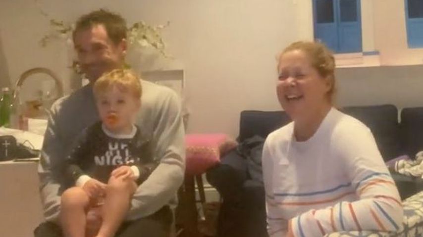 Chris Fischer mit seinem Sohn Gene und Amy Schumer