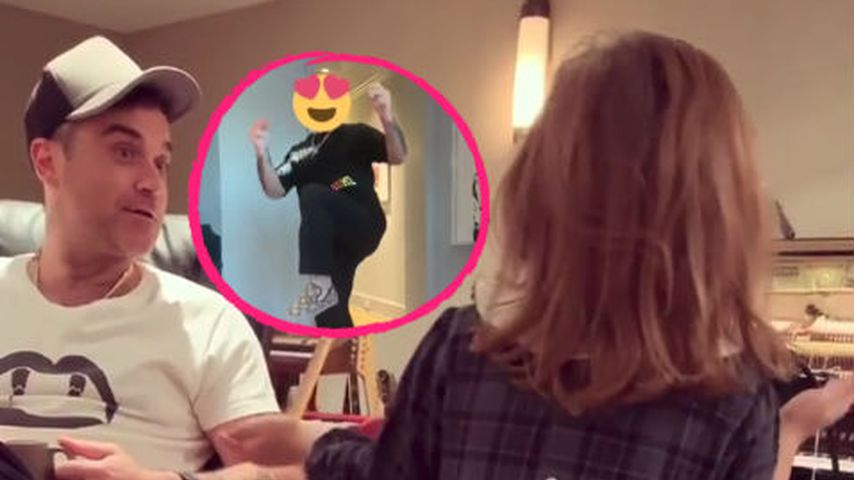Mit Smiley-Kopf: Robbie Williams tanzt für Töchterchen Teddy