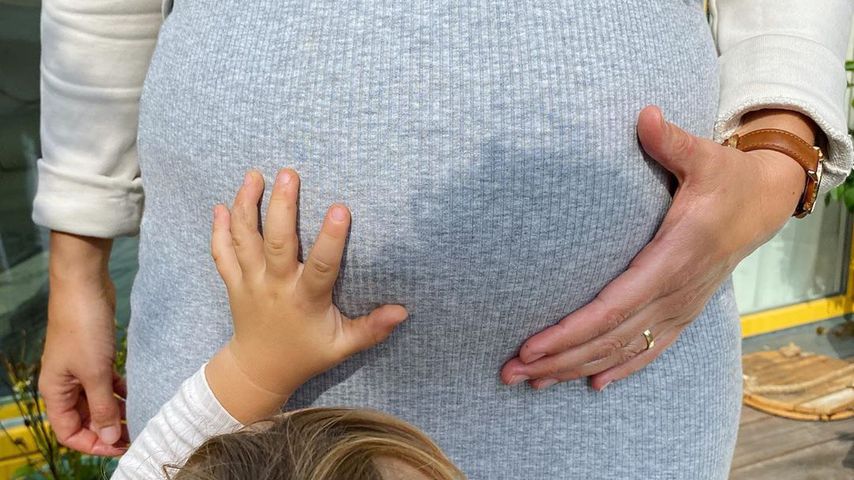 Der Babybauch von Michael Schultes Frau Katharina und sein Sohn Luis