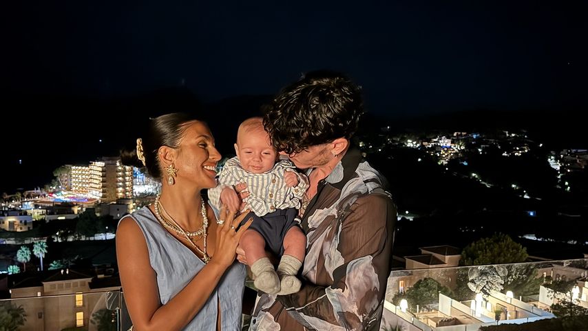 Emily Faye Miller und Cam Holmes mit Baby Reggie