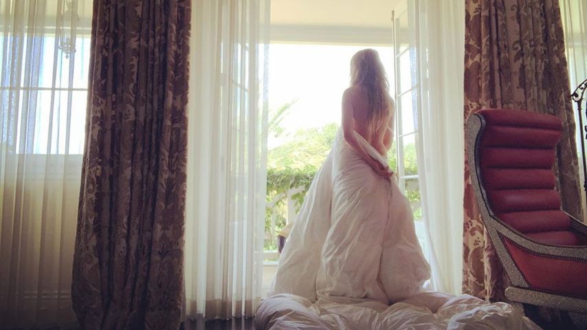 Sexy Kehrseite: Heidi Klum nur in Bettlaken gehüllt!