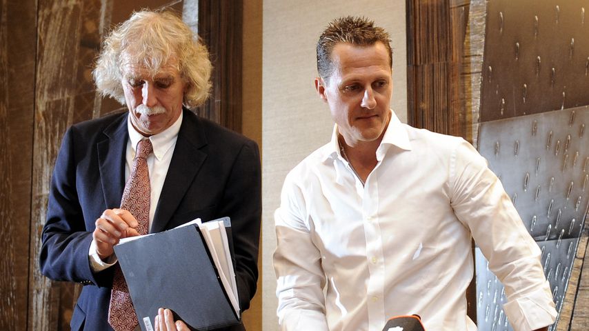 Johannes Peil und Michael Schumacher im Jahr 2009