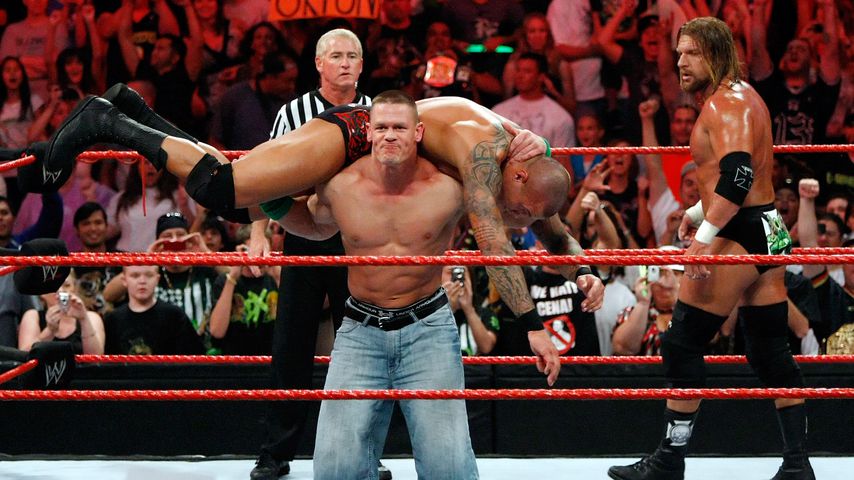 John Cena, Randy Orton und Triple H im August 2009