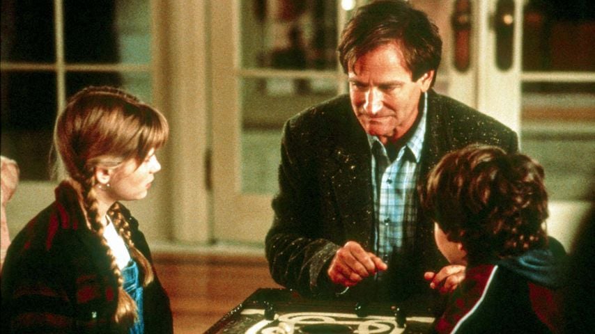 Kirsten Dunst, Robin Williams und Bradley Pierce in einer Szene aus "Jumanji" (1995)