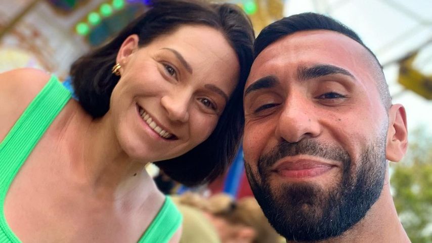 MoTrip (r.) und seine Frau Larissa im Juli 2022