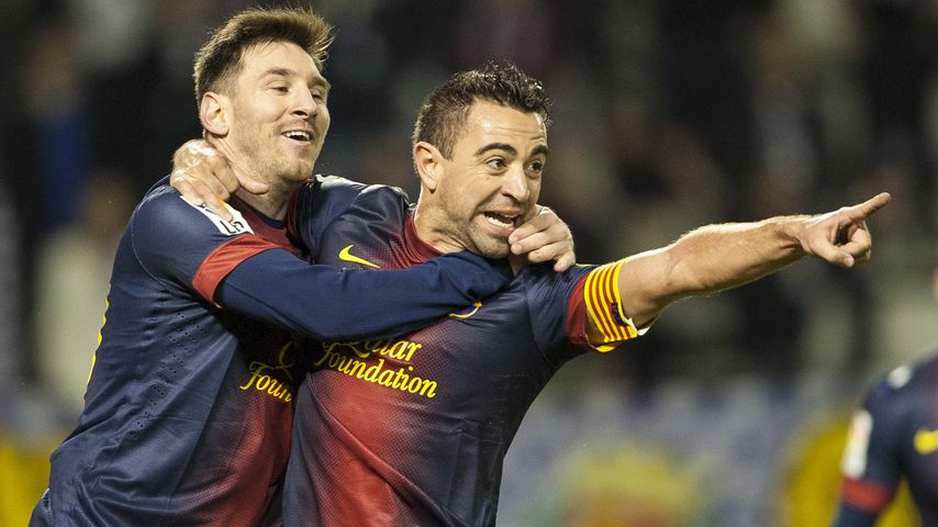 Lionel Messi und Xavi Hernandez, Fußballer