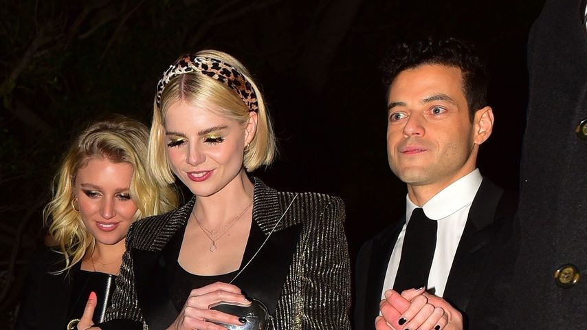 Etwas angetrunken? Rami Malek muss Freundin Lucy stützen!