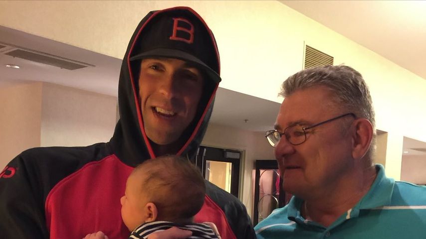 Michael Phelps mit seinem Sohn und seinem Vater