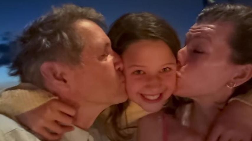 Paul W.S. Anderson (l.), Milla Jovovich (r.) und ihre Tochter