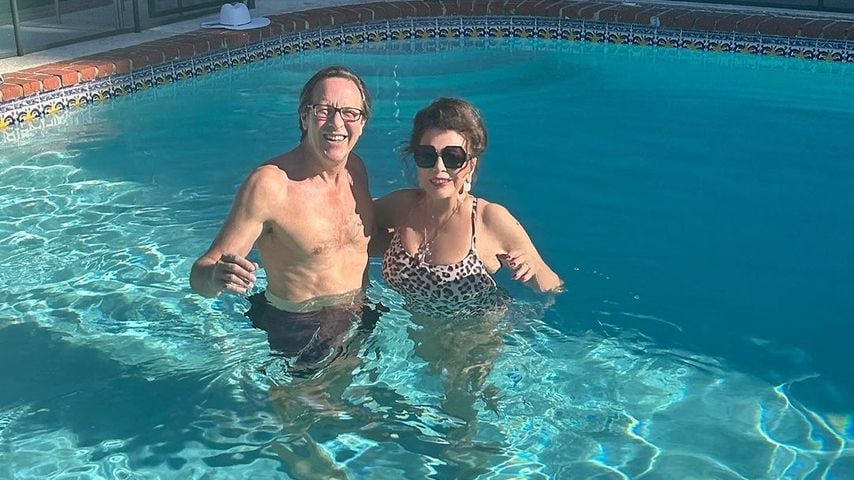 Percy Gibson und Joan Collins im Dezember 2022
