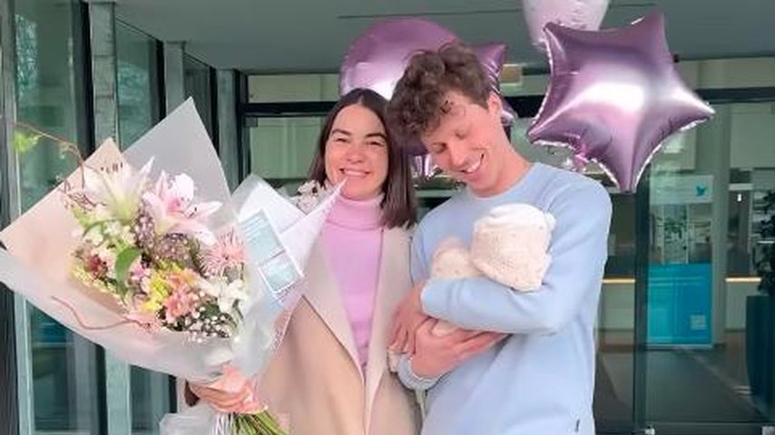 Renata und Valentin Lusin mit ihrem Kind