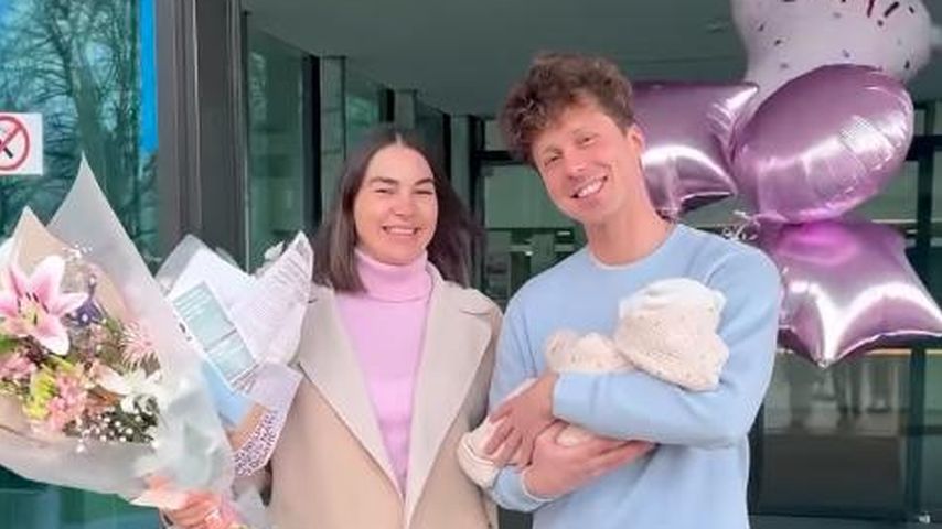Renata und Valentin Lusin mit ihrer kleinen Tochter