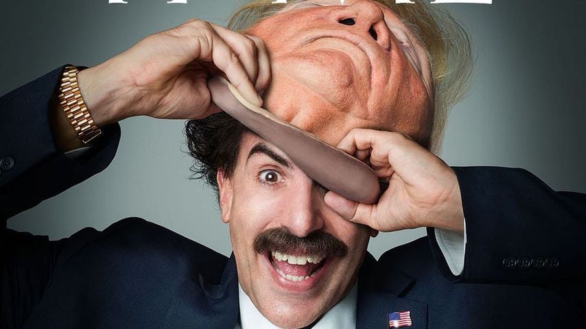 Sacha Baron Cohen in seiner Rolle als Borat und mit Trump-Maske